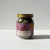 Jar of 'It's Over, Goodnight' tea with a purple label on a white background