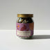 Jar of 'It's Over, Goodnight' tea with a purple label on a white background